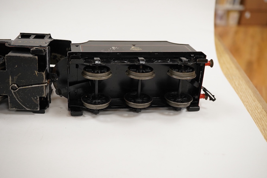 An 0 gauge Bassett-Lowke live steam spirit fired tinplate BR 2-6-0 Mogul tender locomotive, 42980, with original fuel tank and burner, two controls in the cab accessed through the cab roof